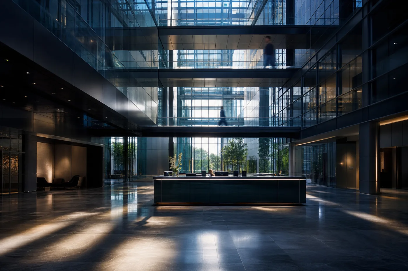 Glass atrium with steel bridges at a security company headquarters