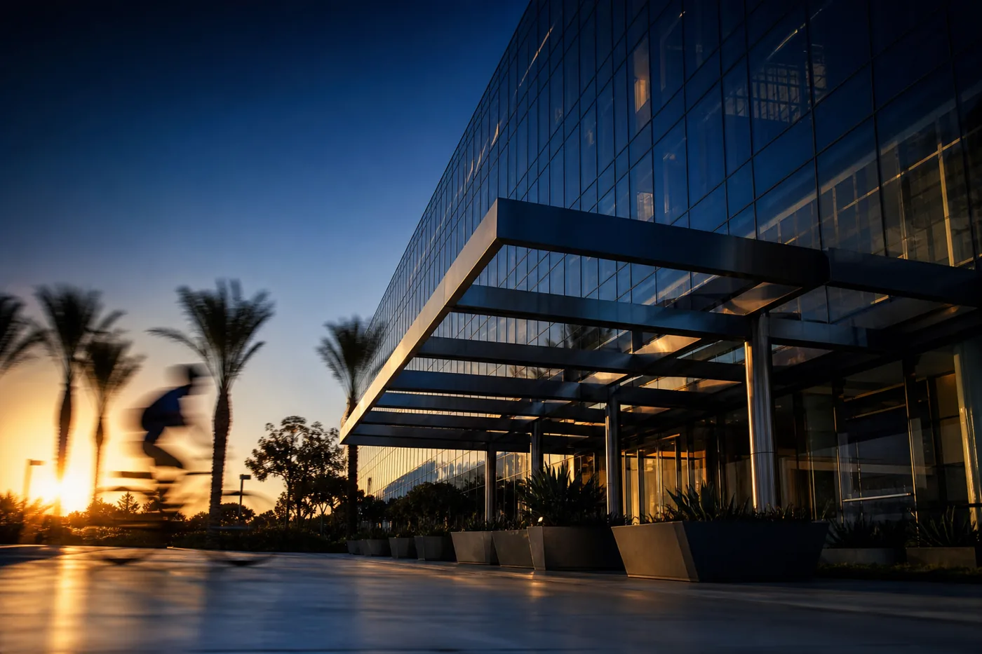 Glass office building on a sunlit coastal campus in San Diego