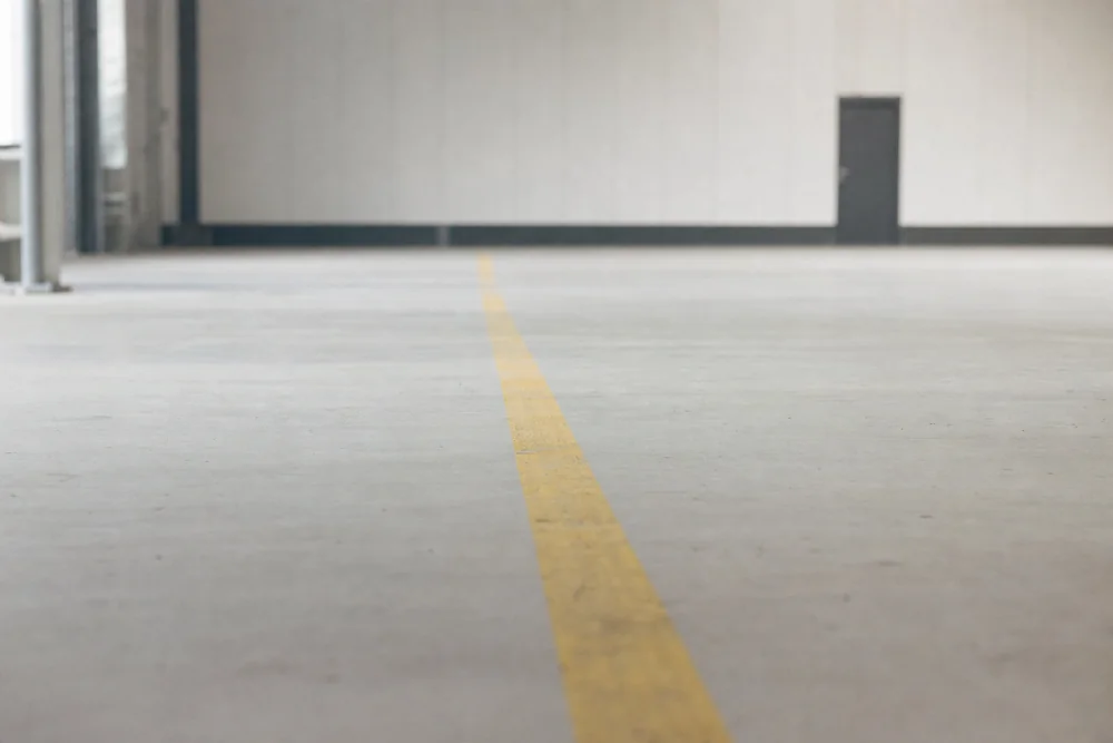 Reducing NIST 800-171 CUI scope shown as a painted boundary line across a facility floor